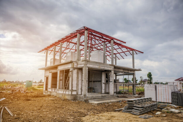 construction residential new house in progress at building site Construction Residential New House In Progress At Building Site